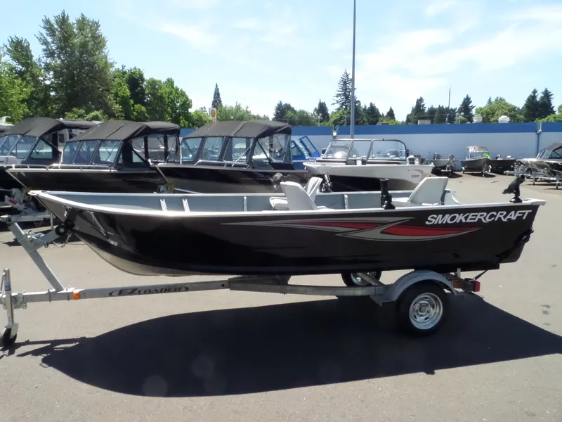 Slide: The Image of 2017 Smoker Craft Alaskan boat on trailer in outdoor lot. - 5