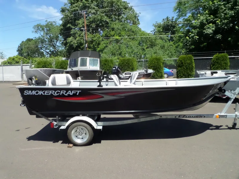 Slide: The Image of 2017 Smoker Craft Alaskan boat on trailer in outdoor lot. - 8