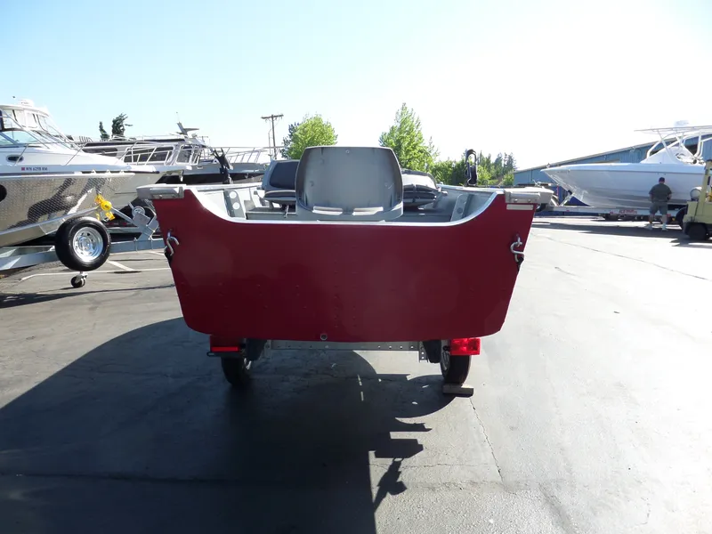 Slide: The Image of 2017 Smoker Craft Alaskan boat on trailer in marina. - 3