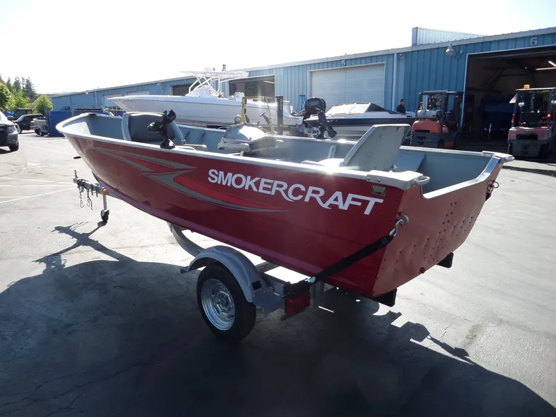 Slide: The Image of 2017 Smoker Craft Alaskan boat on trailer in outdoor storage area. - 4
