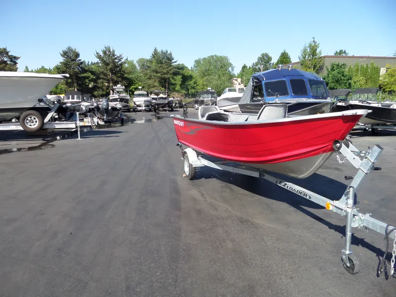 Slide: The Image of 2017 Smoker Craft Alaskan boat on trailer in a boatyard. - 7
