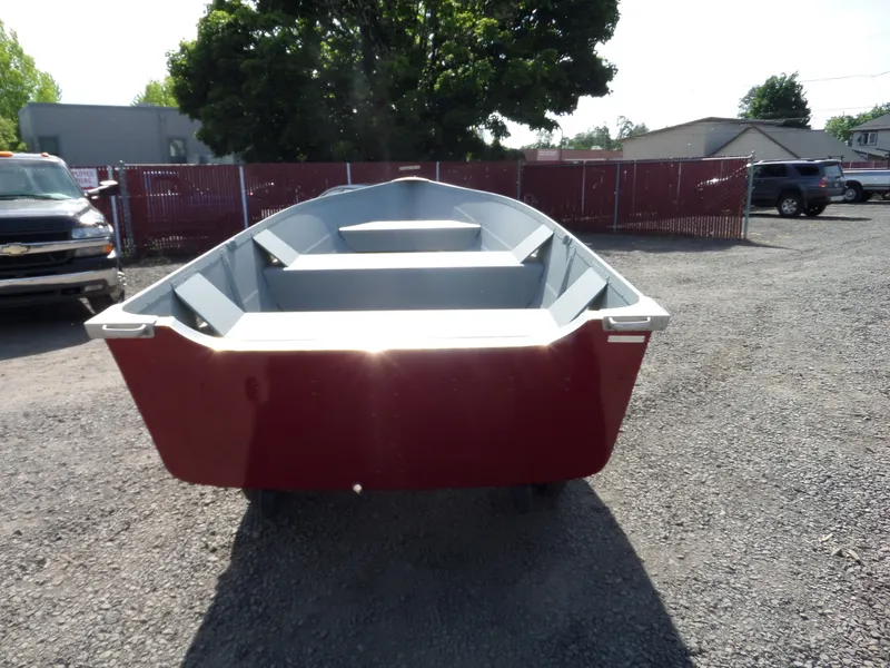 Slide: The Image of 2017 Smoker Craft Alaskan boat in a parking lot. - 6