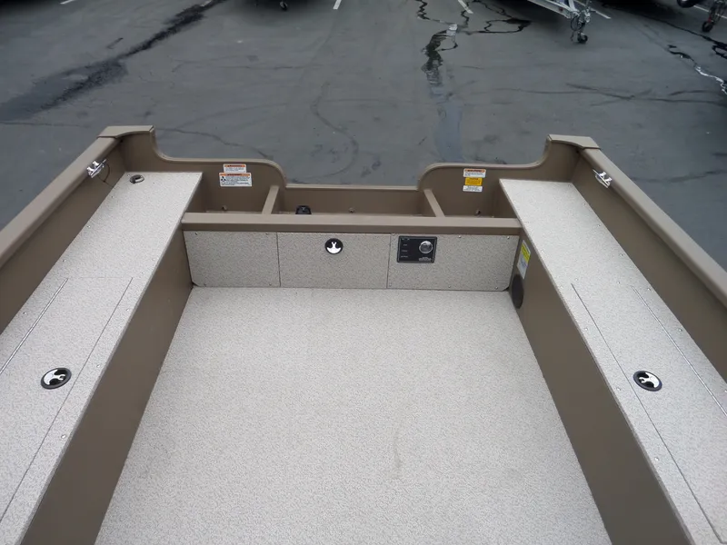 Slide: The Image of 2017 Smoker Craft Freedom boat interior with storage compartments and seating. - 10