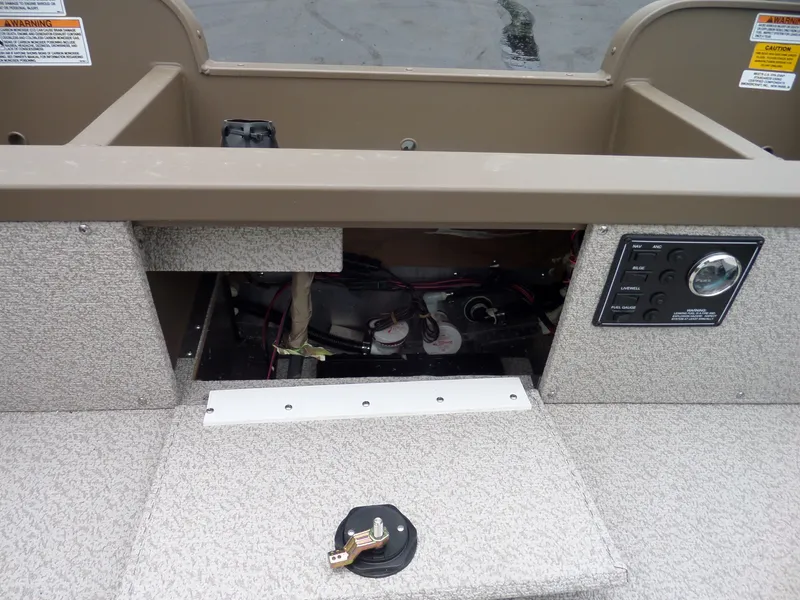 Slide: The Image of 2017 Smoker Craft Freedom boat interior showing control panel and wiring. - 11