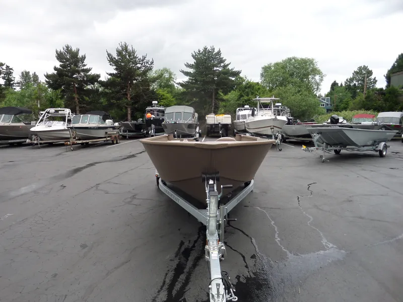 Slide: The Image of 2017 Smoker Craft Freedom boat on trailer in a boatyard. - 3