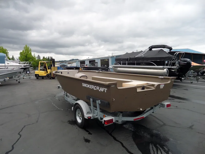 Slide: The Image of 2017 Smoker Craft Freedom boat on trailer in a marina. - 4