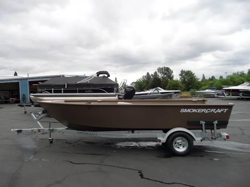 Slide: The Image of 2017 Smoker Craft Freedom boat on trailer in a marina. - 8