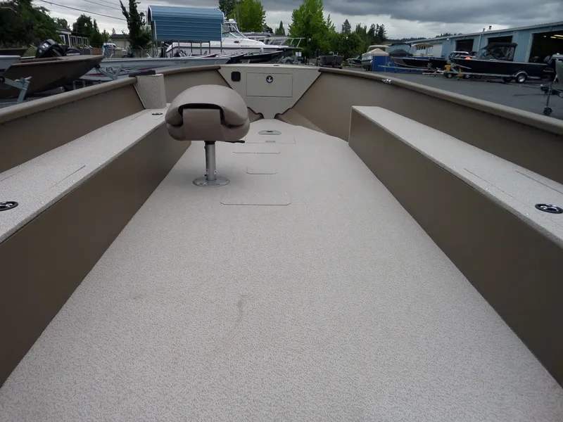 Slide: The Image of 2017 Smoker Craft Freedom boat interior with seating and storage compartments. - 9