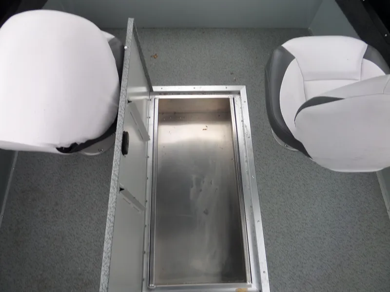 Slide: The Image of 2017 Smoker Craft Osprey boat interior with two white seats and storage compartment. - 11