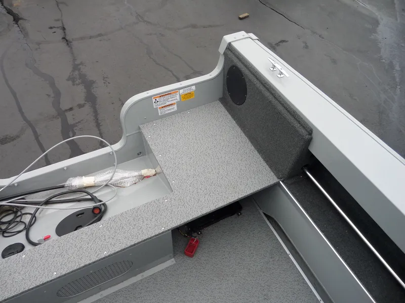 Slide: The Image of 2017 Smoker Craft Osprey boat interior with storage and wiring. - 9