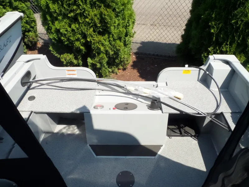 Slide: The Image of 2017 Smoker Craft PRO TRACER boat interior with storage compartments and wiring. - 10