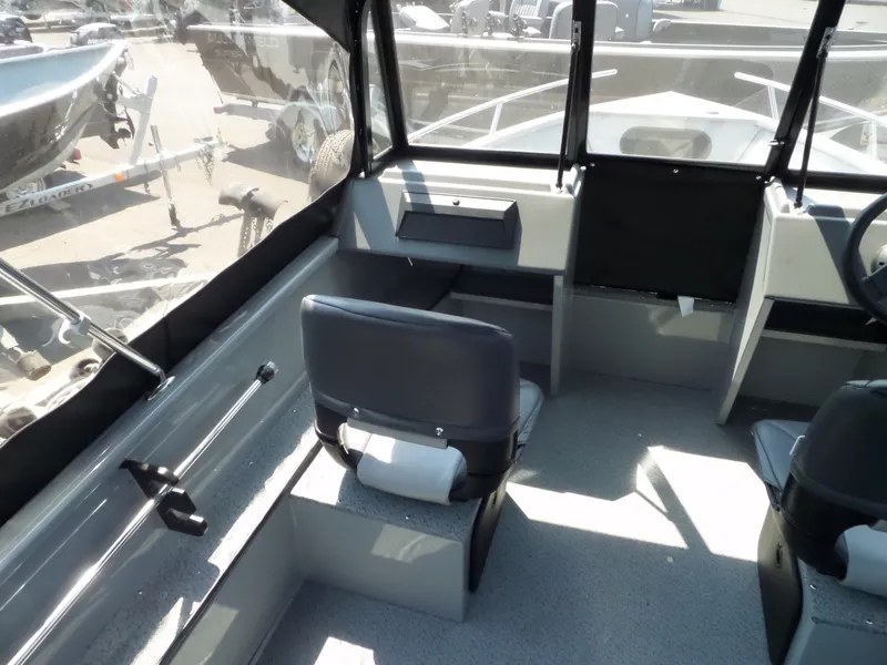 Slide: The Image of 2017 Smoker Craft PRO TRACER boat interior with seating and dashboard. - 12