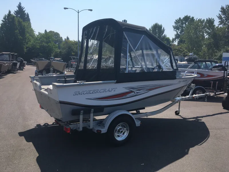 Slide: The Image of 2017 Smoker Craft PRO TRACER boat on trailer in outdoor lot. - 4