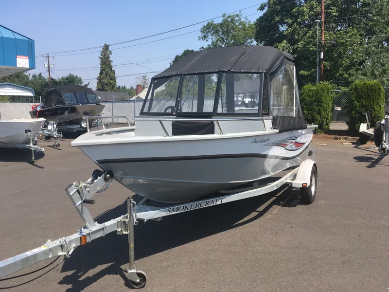 Slide: The Image of 2017 Smoker Craft PRO TRACER boat on trailer in outdoor lot. - 6