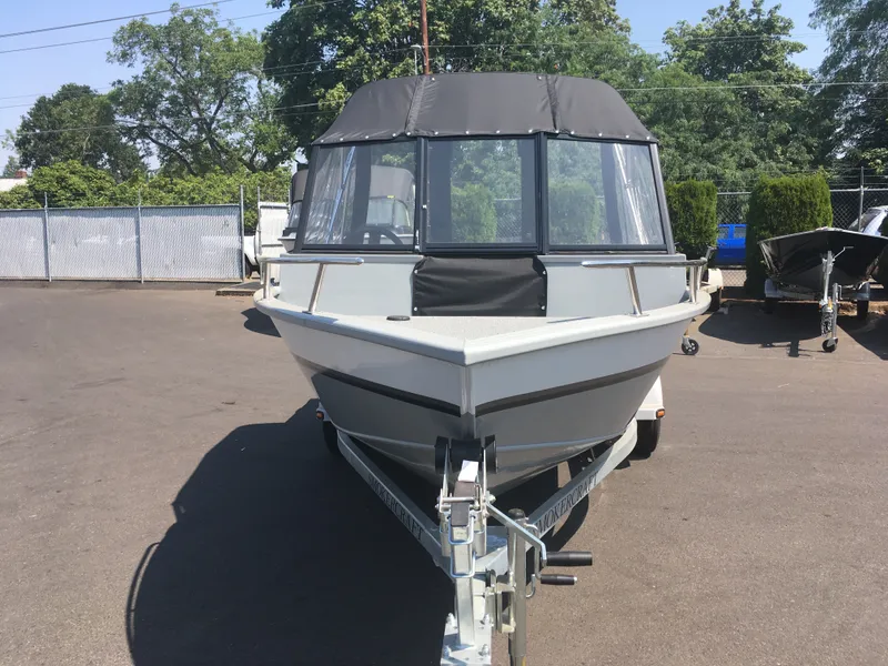 Slide: The Image of 2017 Smoker Craft PRO TRACER boat on trailer in outdoor lot. - 7