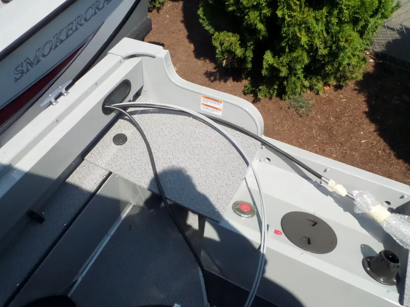 Slide: The Image of 2017 Smoker Craft PRO TRACER boat interior with cables and control panel. - 8