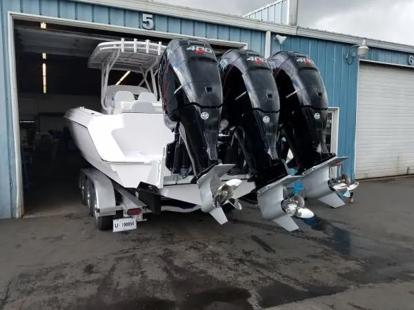 Slide: The Image of 2017 Sonic Center Console High Performance Sport Fish boat with triple 400HP engines. - 6