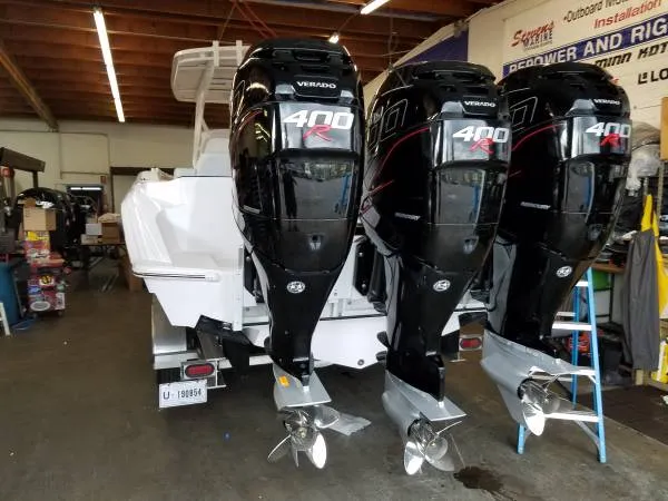 Slide: The Image of 2017 Sonic Center Console High Performance Sport Fish boat with triple 400R Verado engines. - 7