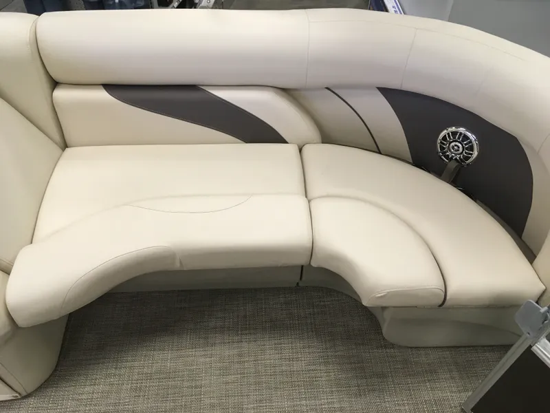 Slide: The Image of 2017 SunChaser REAR LOUNGER boat seating with beige upholstery and integrated speaker. - 10
