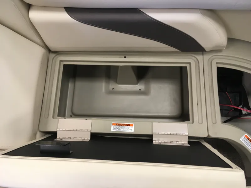 Slide: The Image of 2017 SunChaser REAR LOUNGER storage compartment with open lid. - 11