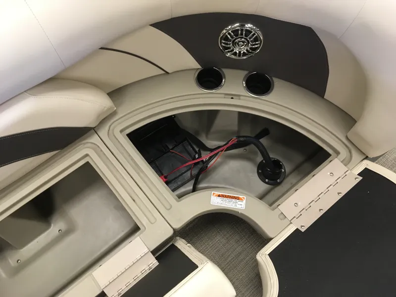 Slide: The Image of 2017 SunChaser REAR LOUNGER boat interior storage compartments and speaker system. - 12