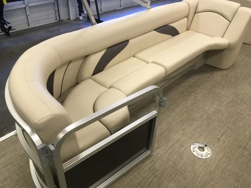 Slide: The Image of 2017 SunChaser REAR LOUNGER boat interior with beige cushioned seating. - 4