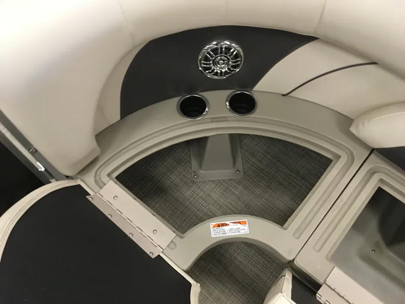 Slide: The Image of 2017 SunChaser REAR LOUNGER boat interior with cup holders and speaker. - 7