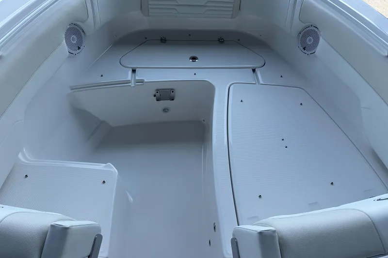 Slide: The Image of Interior of 2026 Edgewater 262CX Crossover boat, featuring spacious seating and storage. - 29