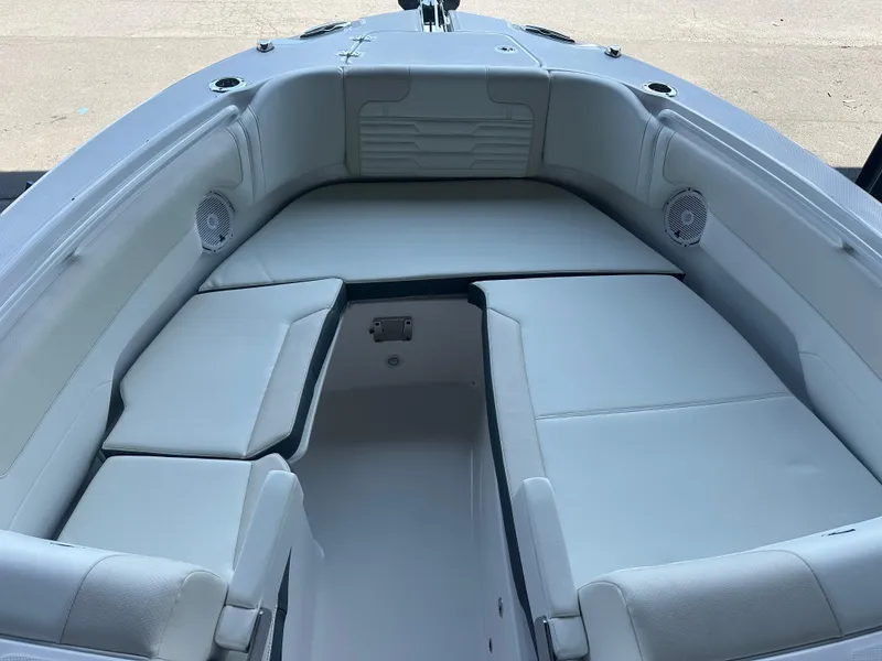 Slide: The Image of Interior view of 2026 Edgewater 262CX Crossover boat with cushioned seating. - 32