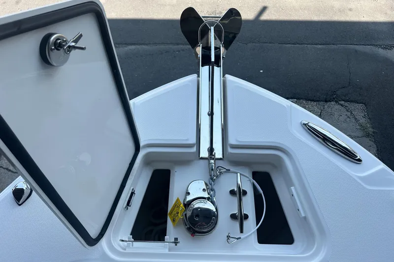Slide: The Image of Anchor compartment of 2026 Edgewater 262CX Crossover boat, featuring a sleek design and modern equipment. - 34