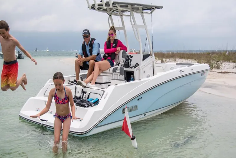 Slide: The Image of Family enjoying Yamaha Boats 210 FSH Sport 2023 at the beach. - 3