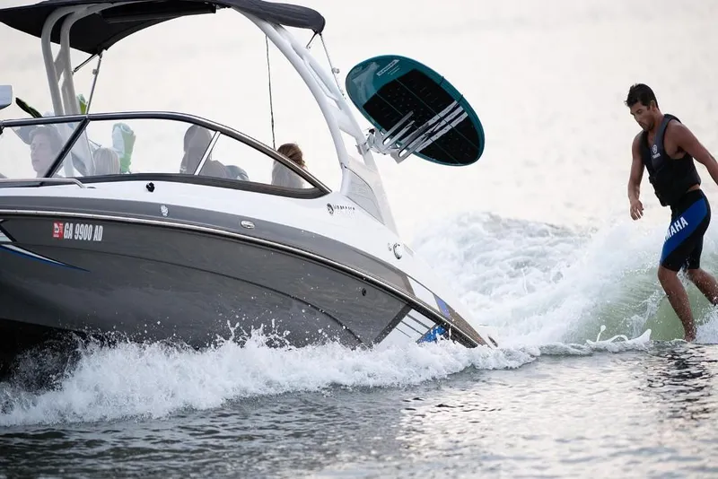 Slide: The Image of 2023 Yamaha Boats 212X with wakeboarder on the water. - 5