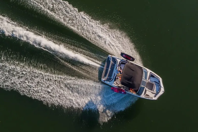 Slide: The Image of Aerial view of 2023 Yamaha Boats AR195 speeding on water. - 6