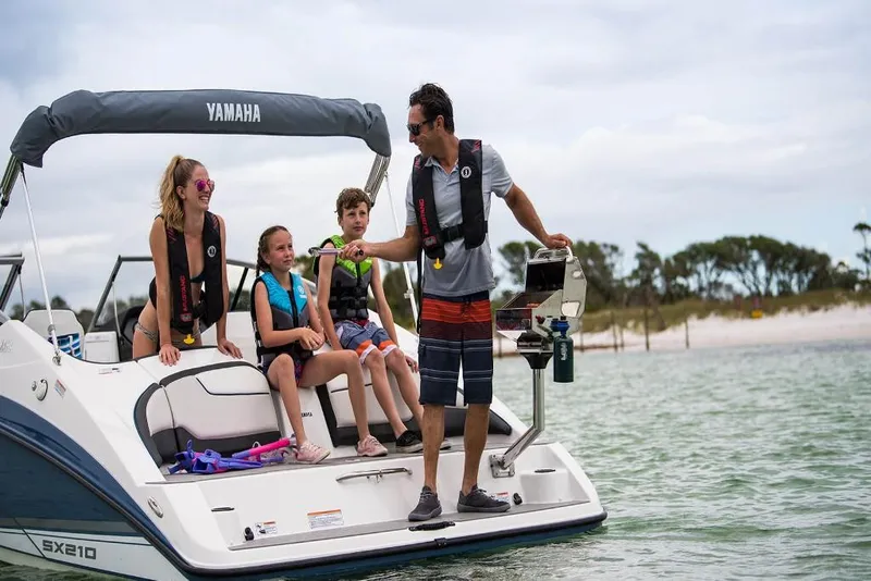 Slide: The Image of Family enjoying a day on a 2023 Yamaha SX210 boat. - 5