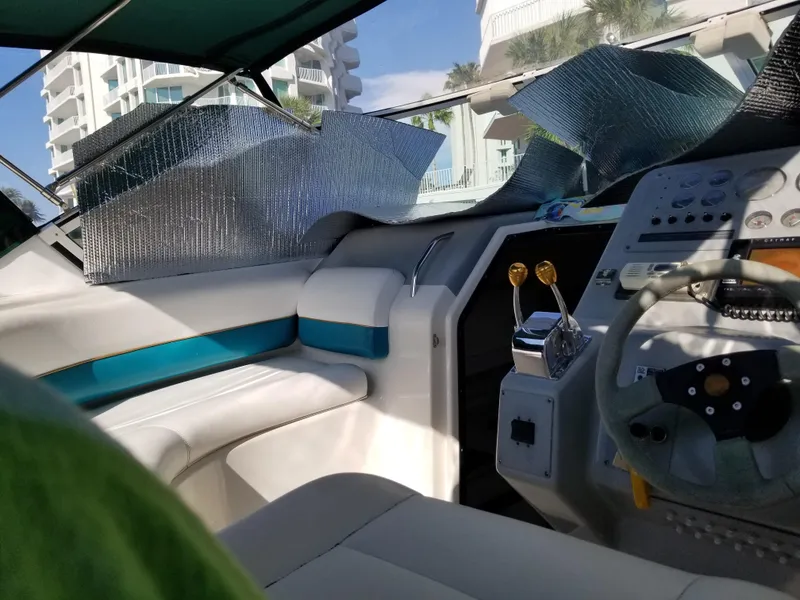 Slide: The Image of Interior of a 1993 Tiara Yachts 270 Sport Cruiser with helm and seating. - 11