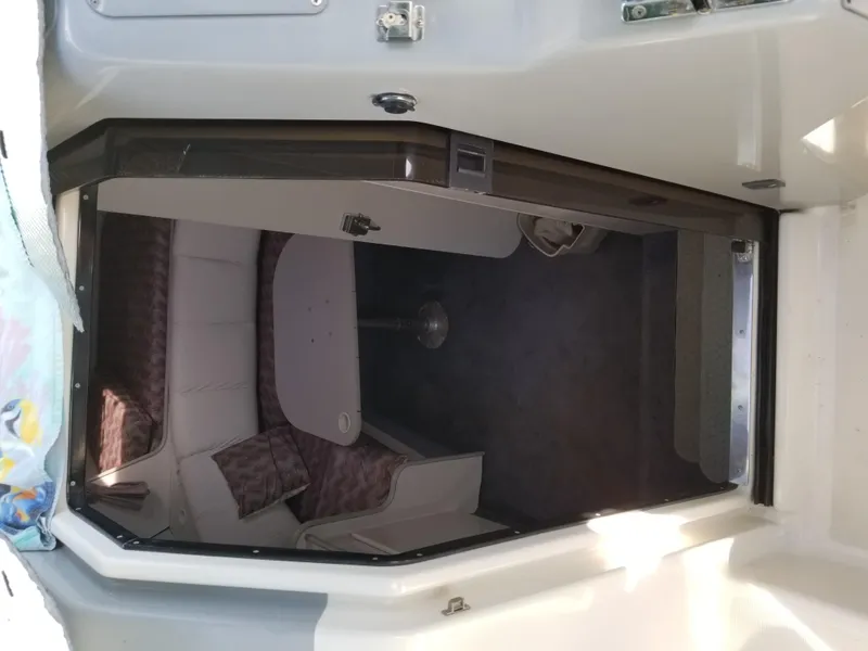 Slide: The Image of 1993 Tiara Yachts 270 Sport Cruiser cabin interior with seating and table. - 15