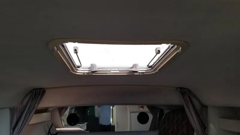 Slide: The Image of Interior cabin of 1993 Tiara Yachts 270 Sport Cruiser with open skylight. - 18