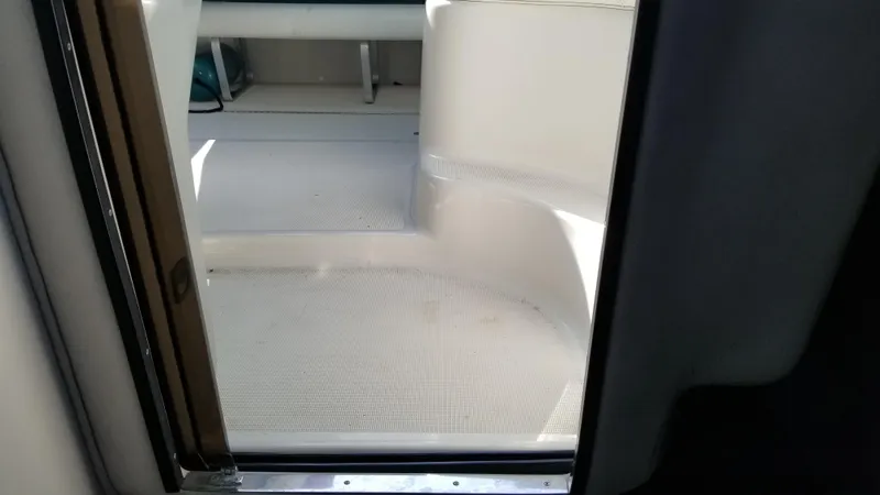 Slide: The Image of 1993 Tiara Yachts 270 Sport Cruiser interior view through cabin door. - 25