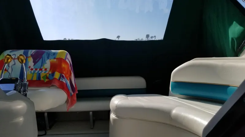 Slide: The Image of Interior of 1993 Tiara Yachts 270 Sport Cruiser with white leather seating. - 27