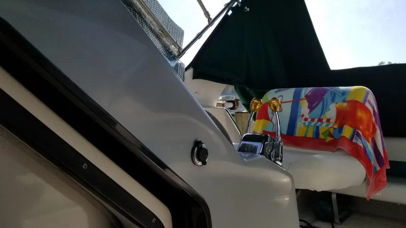 Slide: The Image of 1993 Tiara Yachts 270 Sport Cruiser interior with colorful towel on seat. - 28