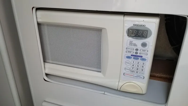 Slide: The Image of Built-in microwave in 1993 Tiara Yachts 270 Sport Cruiser galley. - 32