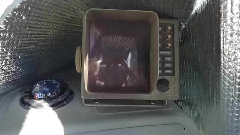 Slide: The Image of 1993 Tiara Yachts 270 Sport Cruiser navigation equipment and compass. - 40