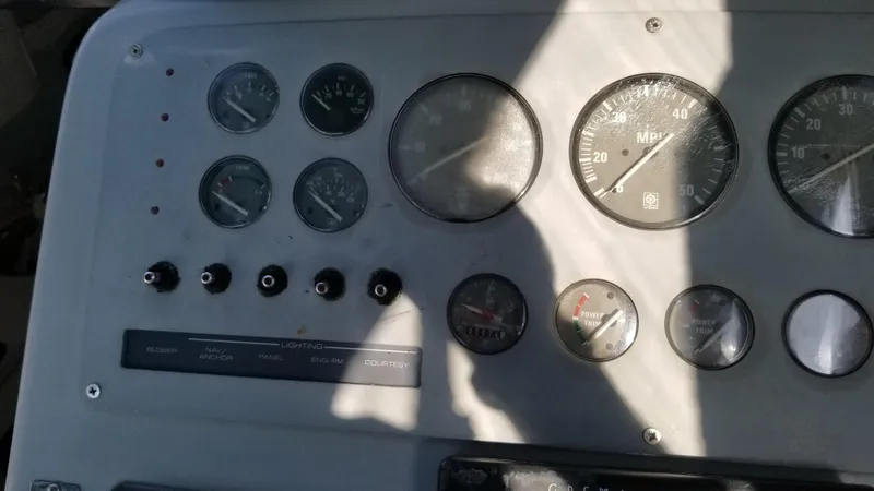 Slide: The Image of Dashboard of a 1993 Tiara Yachts 270 Sport Cruiser with gauges and controls. - 42