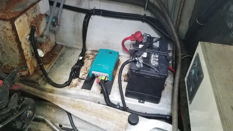 Slide: The Image of 1993 Tiara Yachts 270 Sport Cruiser engine compartment with battery and electrical components. - 45