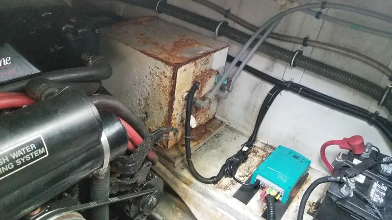 Slide: The Image of 1993 Tiara Yachts 270 Sport Cruiser engine compartment with rusted components. - 46