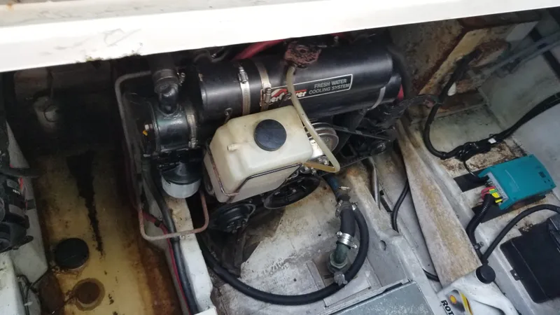 Slide: The Image of 1993 Tiara Yachts 270 Sport Cruiser engine compartment showing engine and components. - 48