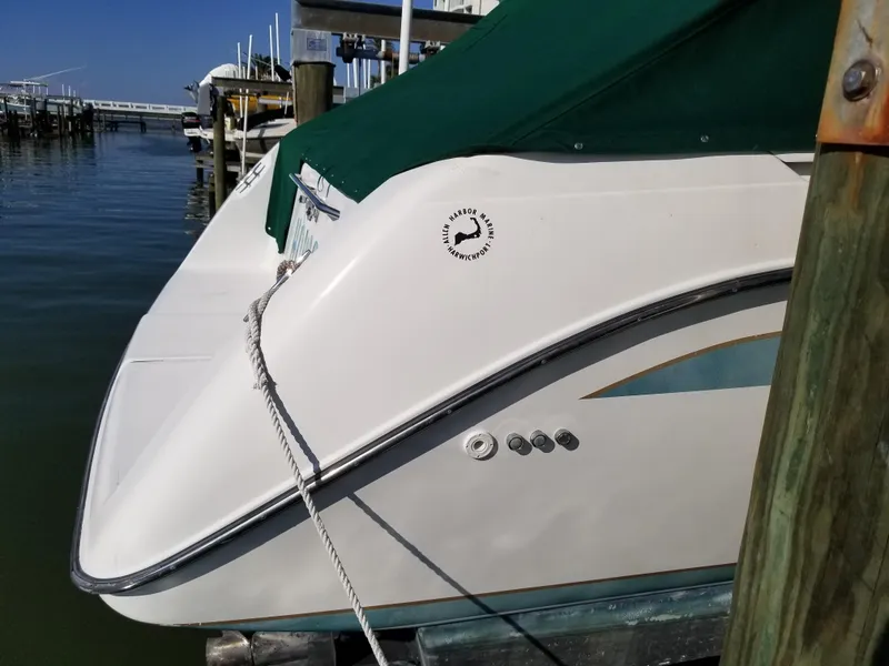 Slide: The Image of 1993 Tiara Yachts 270 Sport Cruiser docked at marina with green cover. - 9