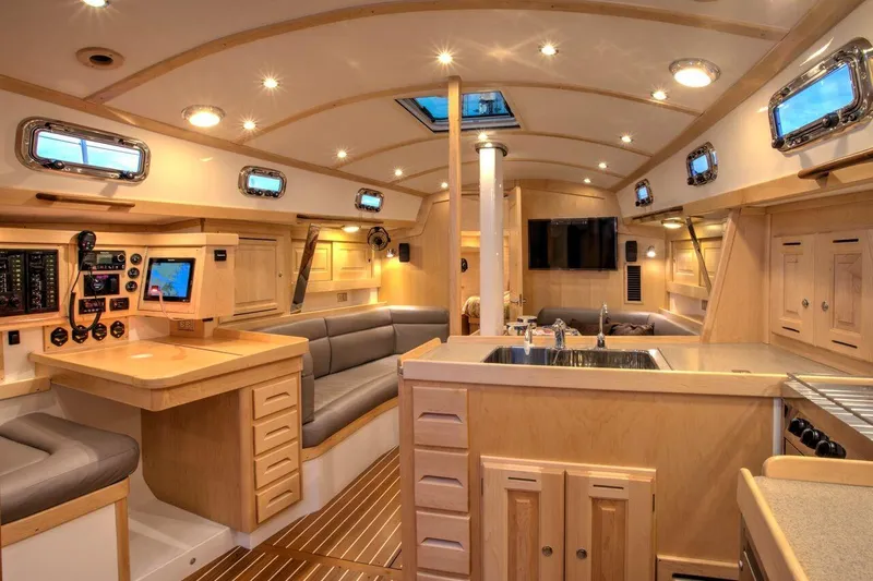 Slide: The Image of Luxurious interior of 2025 Tartan 395 sailboat with modern amenities and elegant wood finishes. - 13