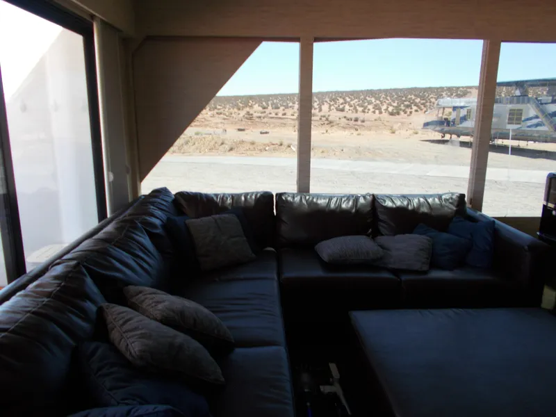 Slide: The Image of Luxurious interior of 2016 Adonia Titan Trip 9 with leather seating and scenic view. - 10