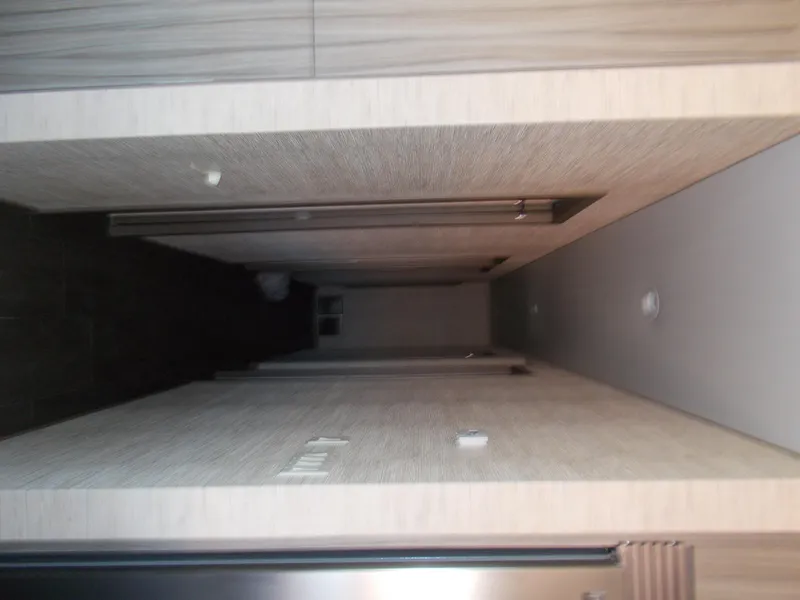 Slide: The Image of Interior hallway of 2016 Adonia Titan Trip 9, featuring modern design and wood paneling. - 15